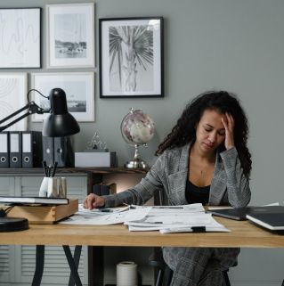 A Woman Working hard in the Office